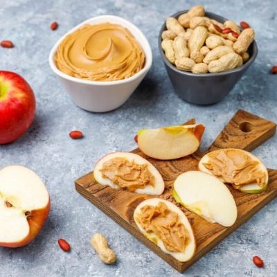 homemade-peanut-butter-with-peanuts-grey-concrete-table-top-view_114579-7065